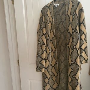 She & sky, one size fits all.  Snake skin print sweater.